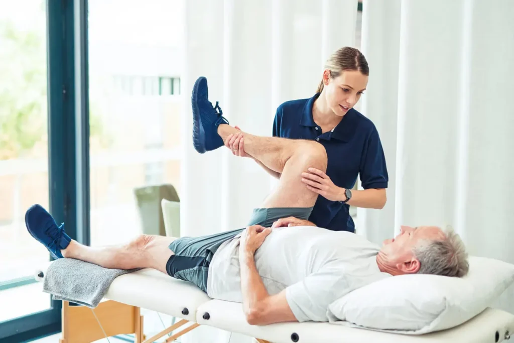 Revitalising Recovery: Effective Rehabilitation Strategies for Muscle Injuries 3 Physiotherapist assisting a patient with muscle recovery exercises Bury St Edmunds