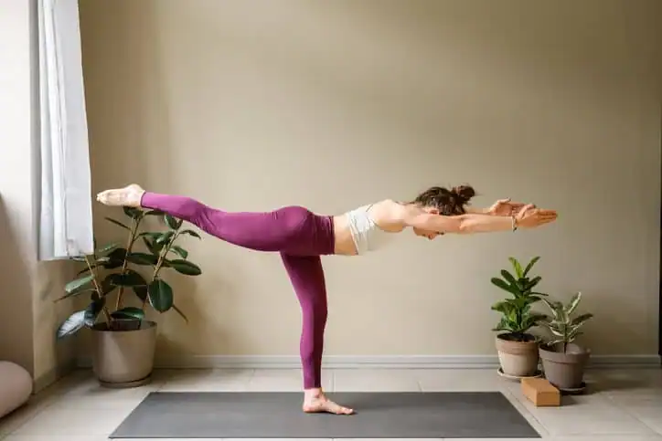 Woman doing Yoga exercise Bury St Edmunds to help with toning the body. 