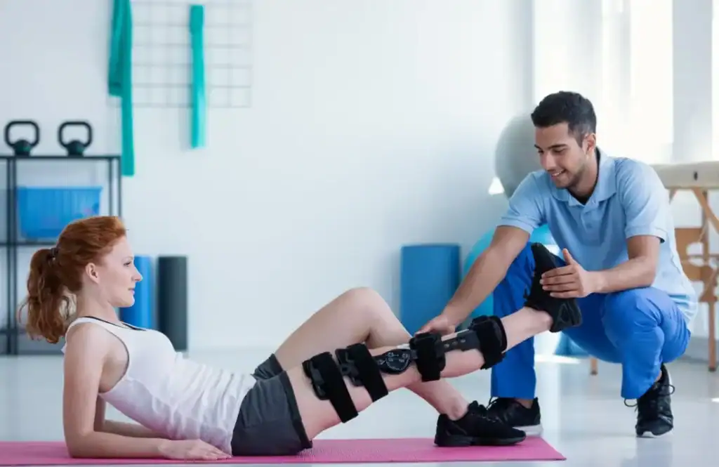 Woman having treatment to help muscle recovery Bury St Edmunds after an injury