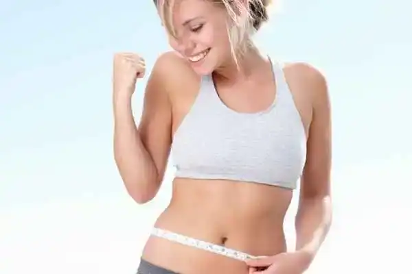 Unraveling the Mystery: Where Does the Body Fat Loss From First? 3 Image of woman happy with fat loss Bury St Edmunds